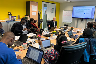 Dr. Estêvão Cordeiro, WHO Technical Officer of NSD, discusses with the TWG-MAG challenges in the development and implementation of guidelines (Source: BfArM/PharmTrain) Dr. Estêvão Cordeiro, WHO Technical Officer of NSD, discusses with the TWG-MAG challenges in the development and implementation of guidelines